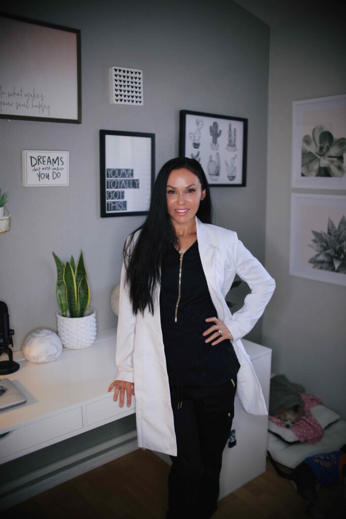 Medical Director, Dr. Shannon Treen shown standing next to her desk in a white lab coat.