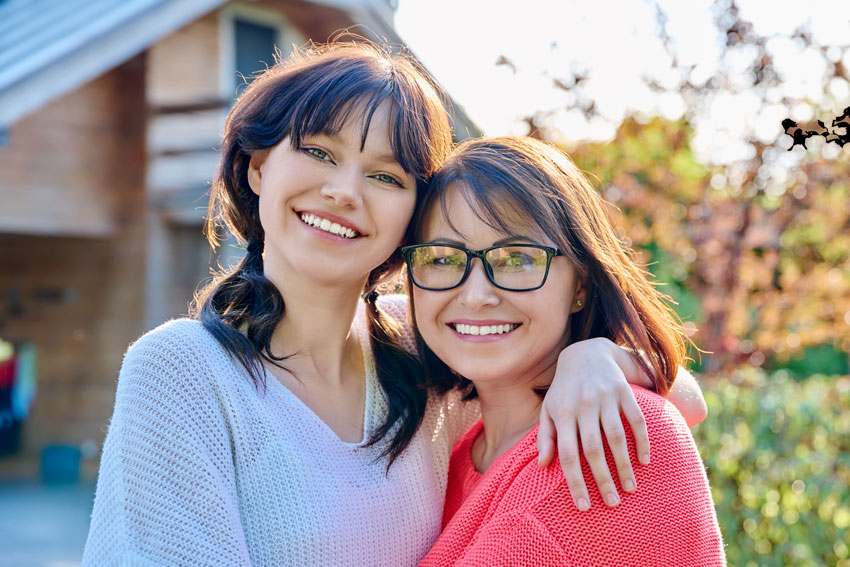 mother and daughter hugging for a photo